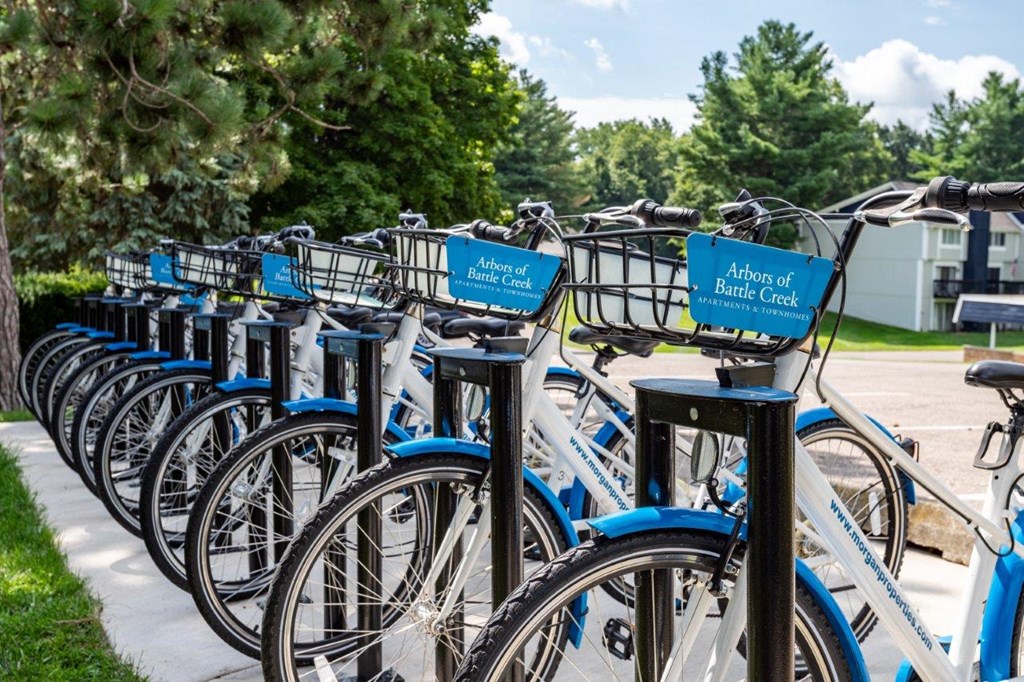 A row of bicycles are parked and labeled "Arts of Battle Creek.".
