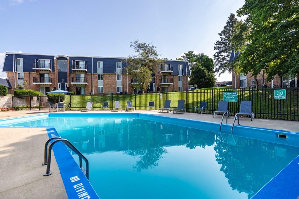 A blue pool with the words "Aqua Swim" written on the side.