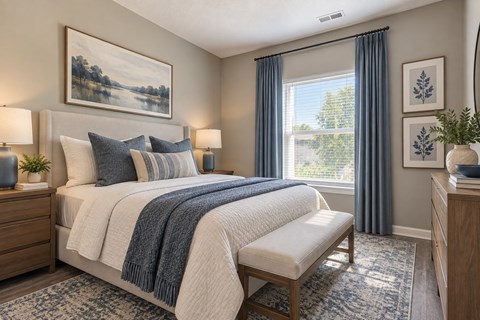 A bedroom with a large bed and a painting on the wall.