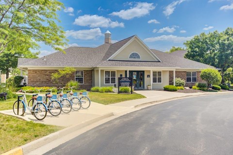 the front of a house with bikes parked in front of it