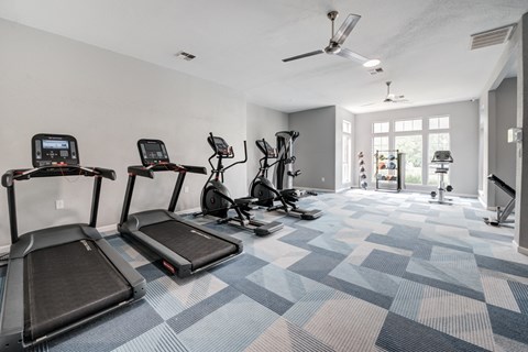 the gathering atrium gym with treadmills and cardio equipment