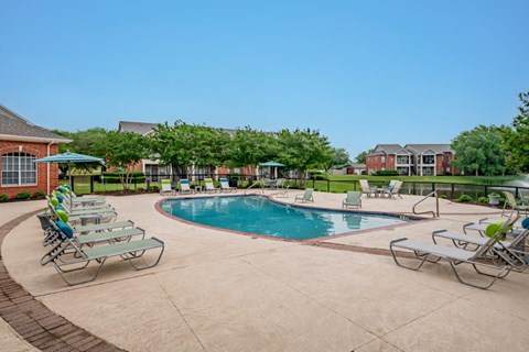 our apartments offer a swimming pool with chairs and umbrellas