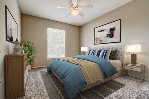 a bedroom with a bed and a ceiling fan