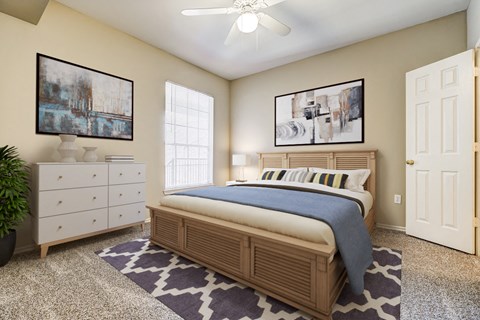 a bedroom with a bed and a dresser