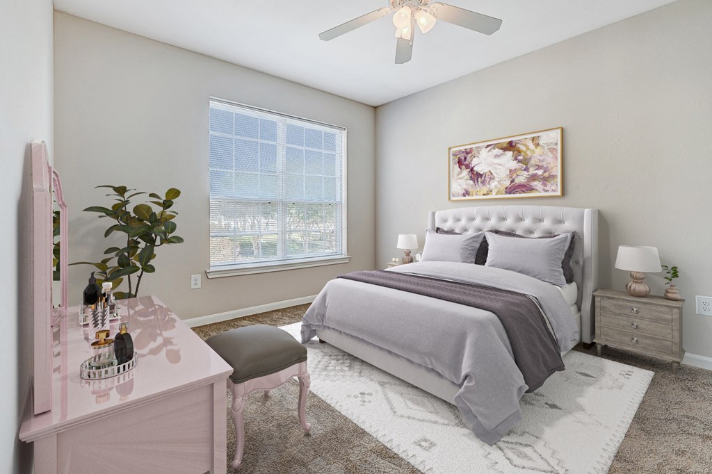 a bedroom with a bed and a ceiling fan