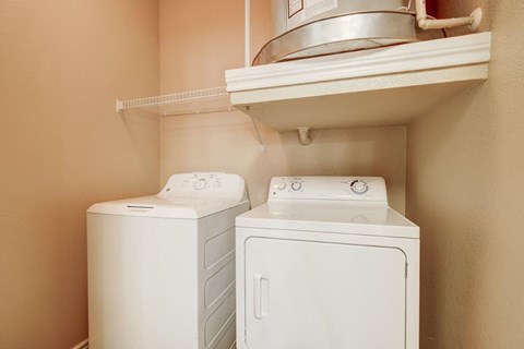 a washer and dryer in the laundry room of a home