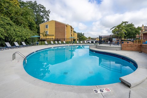 A swimming pool with a height restriction sign of 5'6" on the ground.
