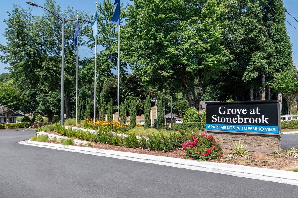 a sign for grove at stonewall gardens  townhomes