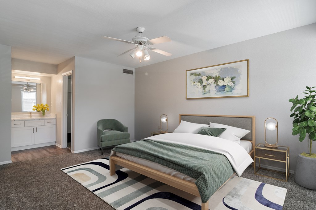 a bedroom with a bed and a ceiling fan