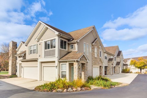A row of houses with a clear blue sky above them.