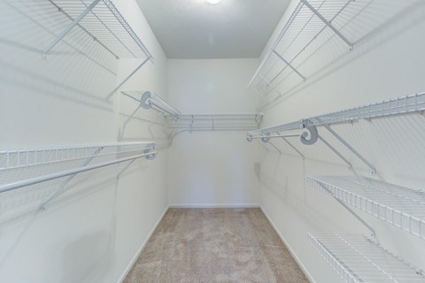 Empty white shelves in a room.