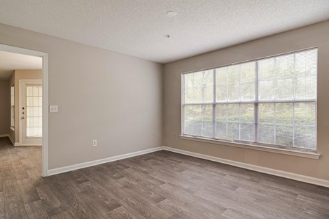 A room with a window and a door.