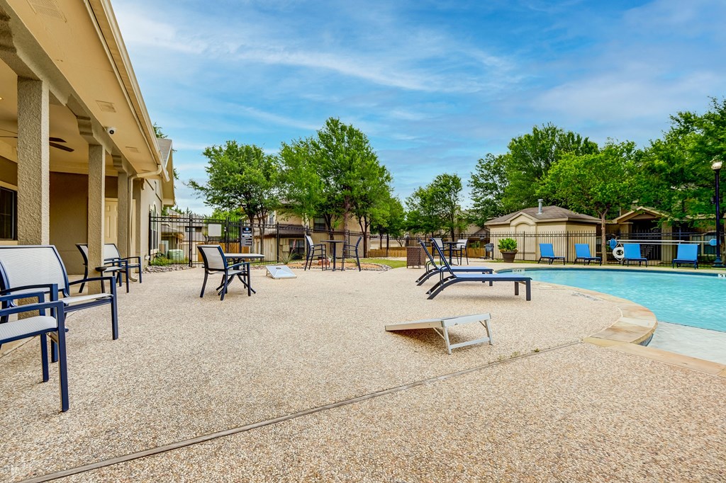 the preserve at ballantyne commons pool and patio area with chairs and a pool