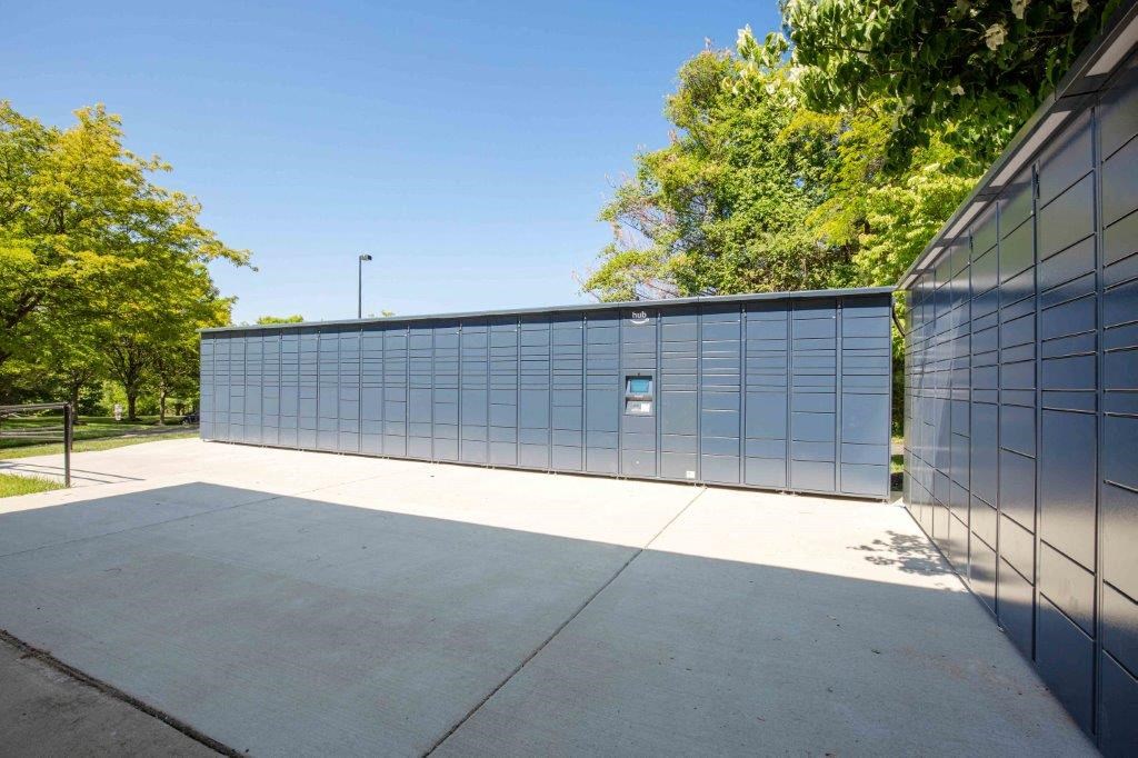 the outside of a building with a long fence and a sidewalk