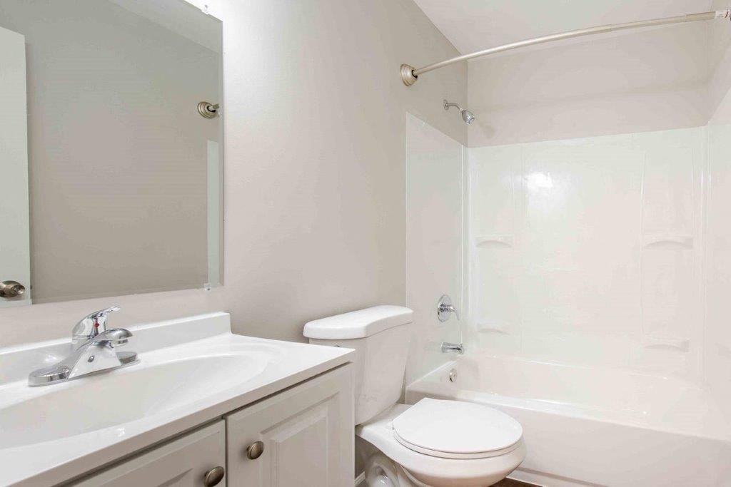 a bathroom with a sink toilet and a shower