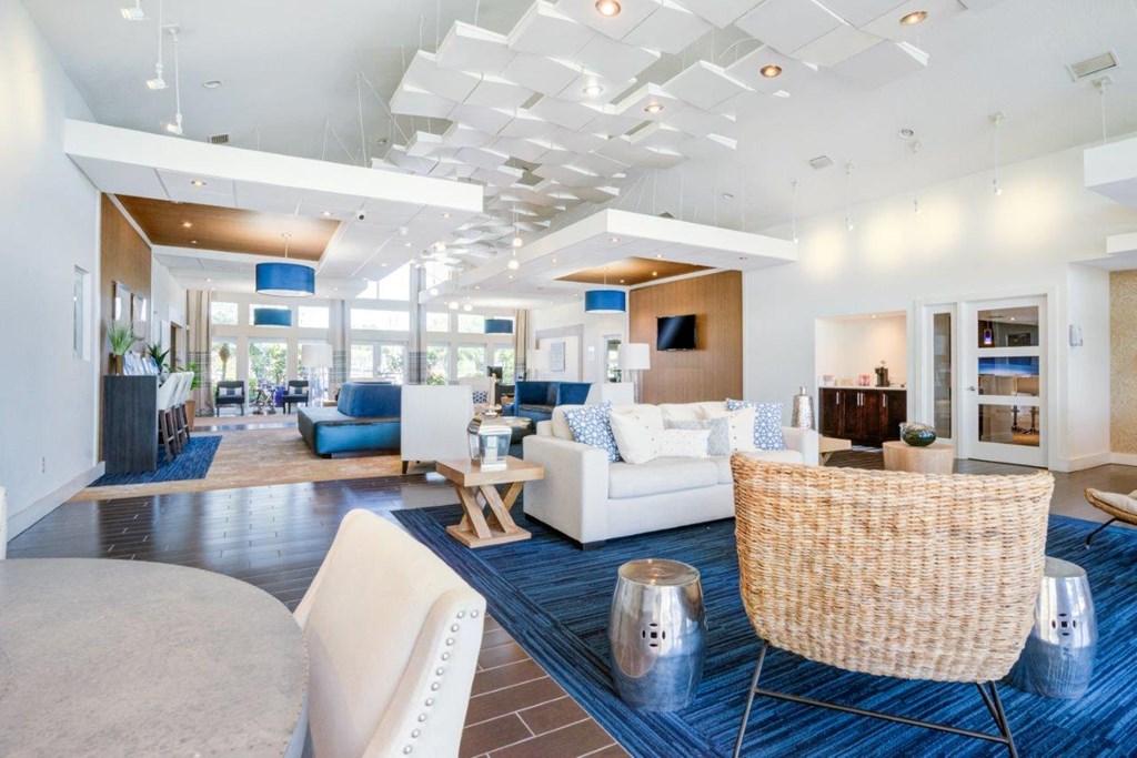 a living room with couches and chairs and a table