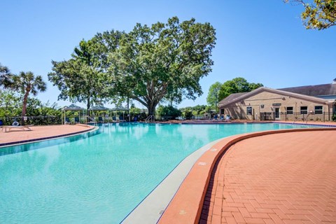 a swimming pool with a building in the background