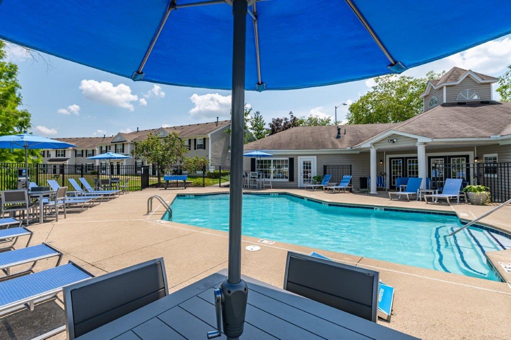 our apartments offer a swimming pool with chairs and umbrellas