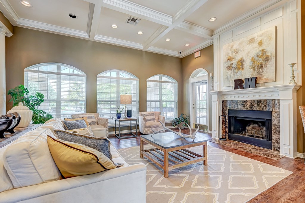 a living room with couches and a fireplace