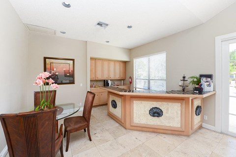 a kitchen and dining room with a table and chairs