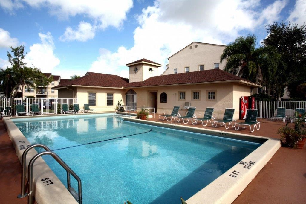 the swimming pool at the resort on a sunny day