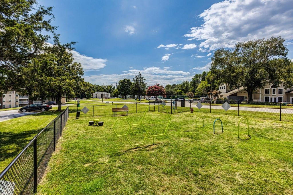 A playground with a swing set and a slide.