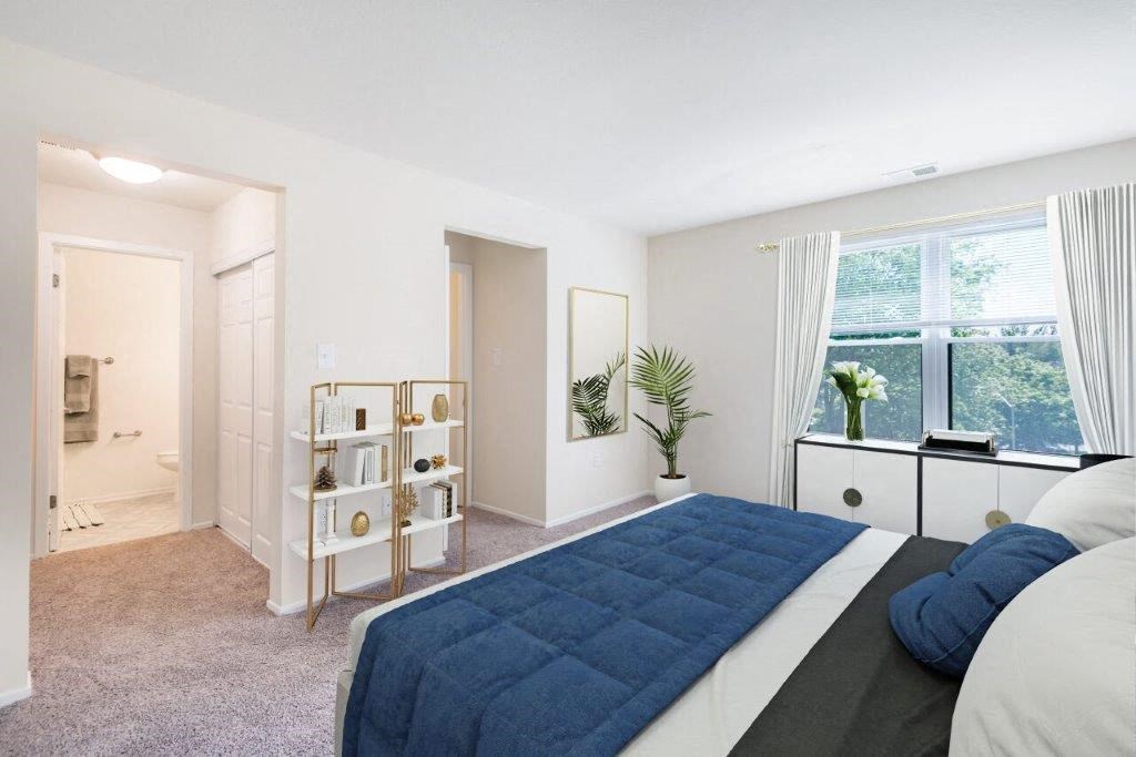 a bedroom with a bed and a closet