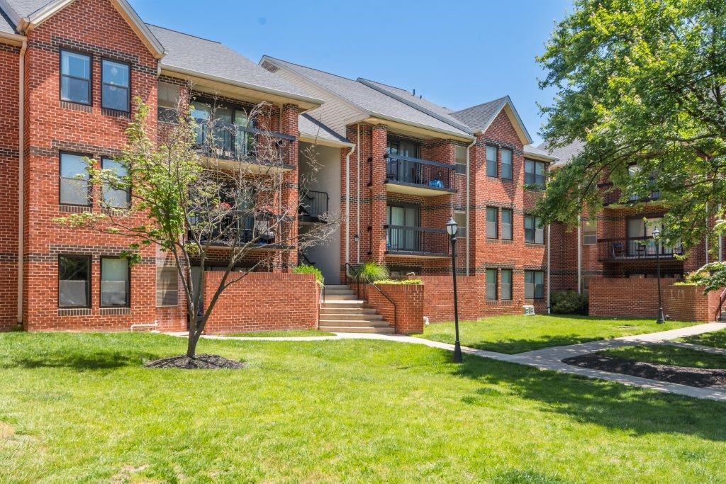 our apartments are located in a quiet neighborhood with green grass and trees