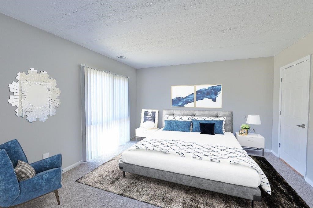 a bedroom with a bed and a blue chair