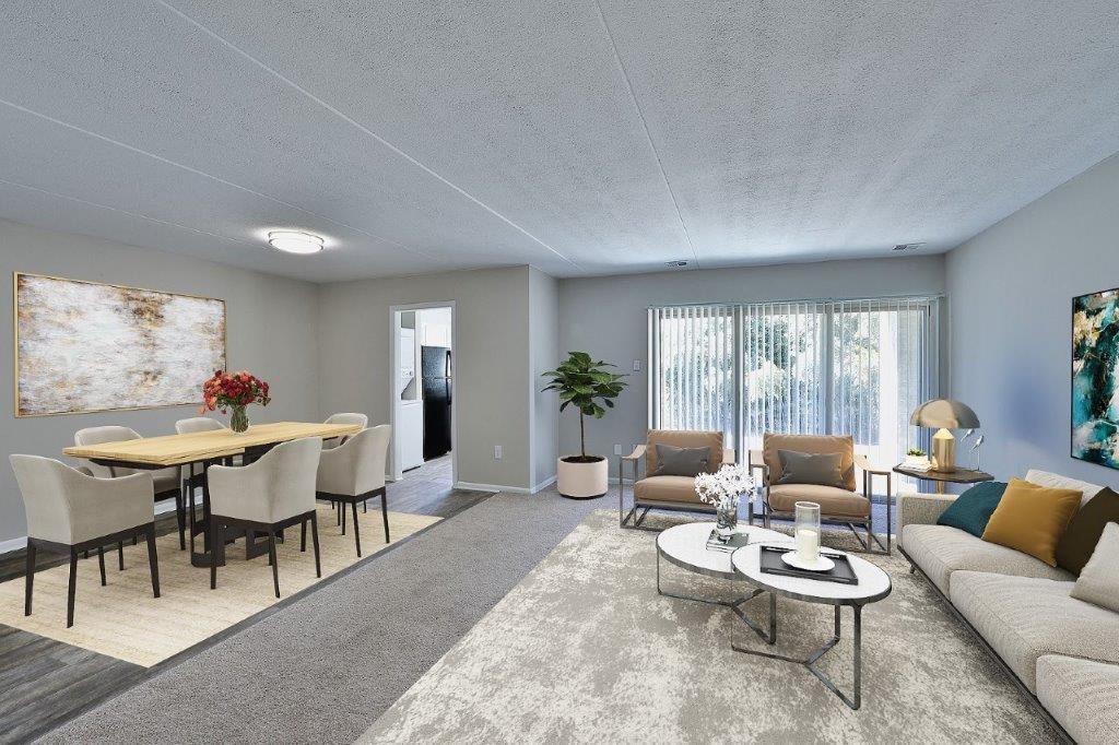 a living room and dining room with a couch and a table