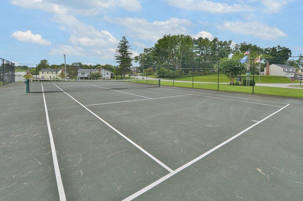the tennis court is clean and ready for players to play