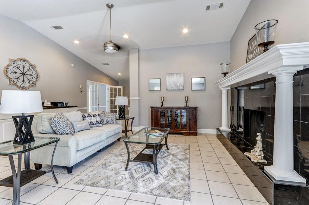 a living room with a fireplace and a couch