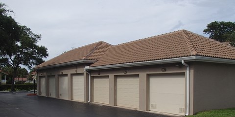 a row of garage doors on the side of a building