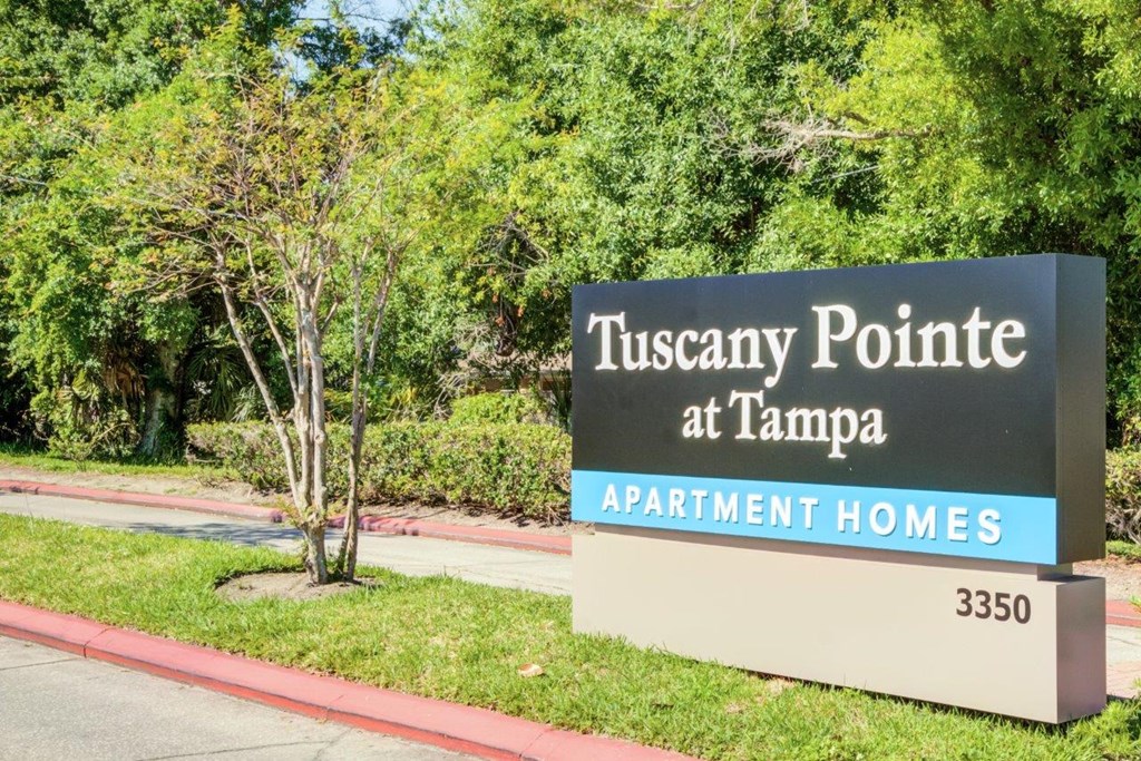 a sign for tuesday point at tampa apartment homes