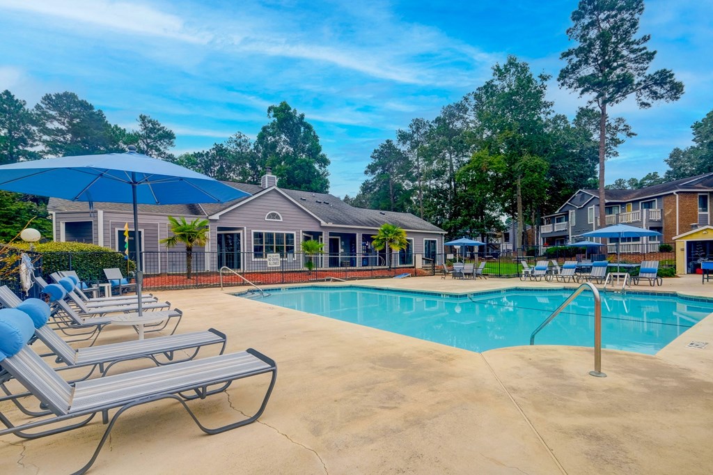 our apartments offer a swimming pool with chairs and umbrellas