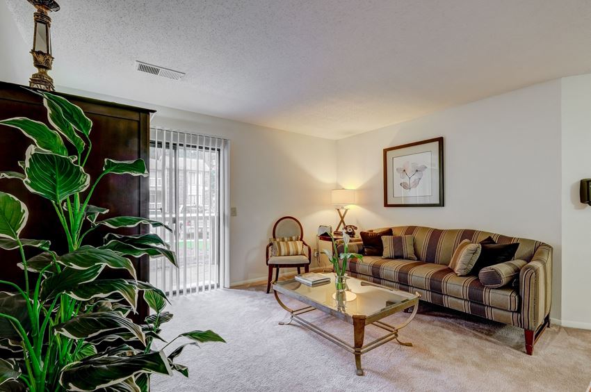 a living room with a couch and a table