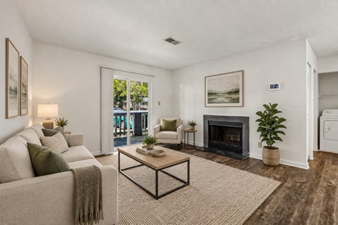 A living room with a fireplace and a couch.