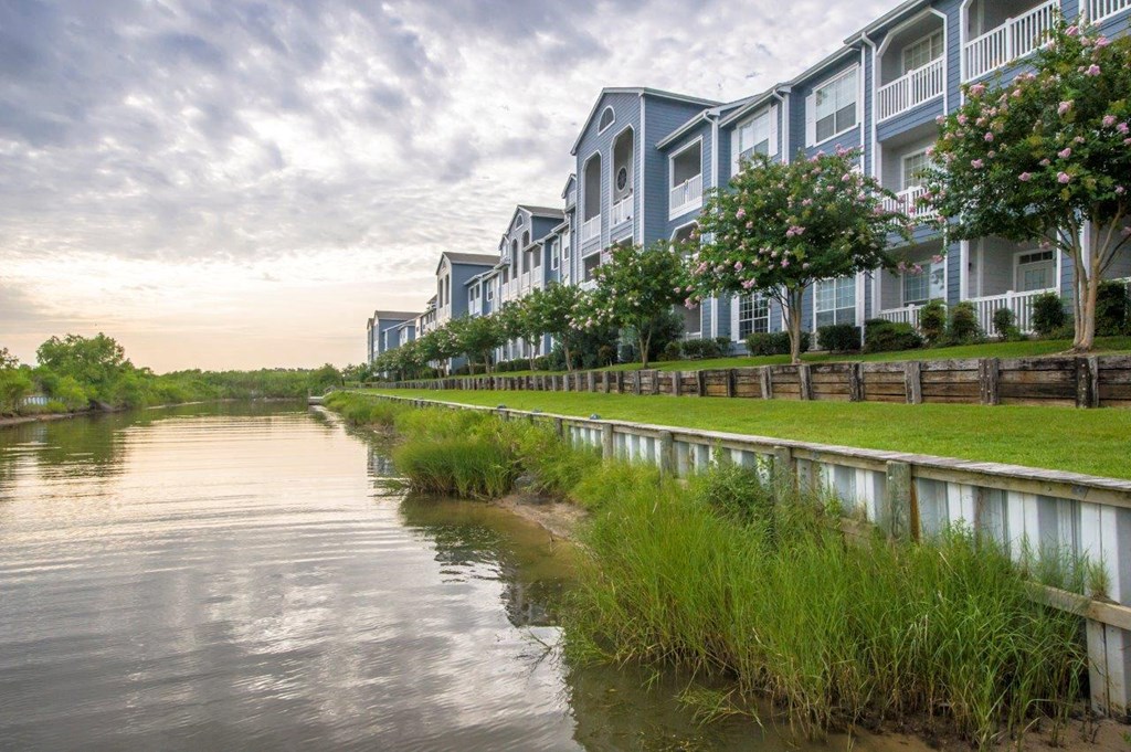 a row of houses next to a body of water