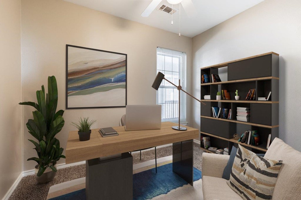 a home office with a laptop on a desk