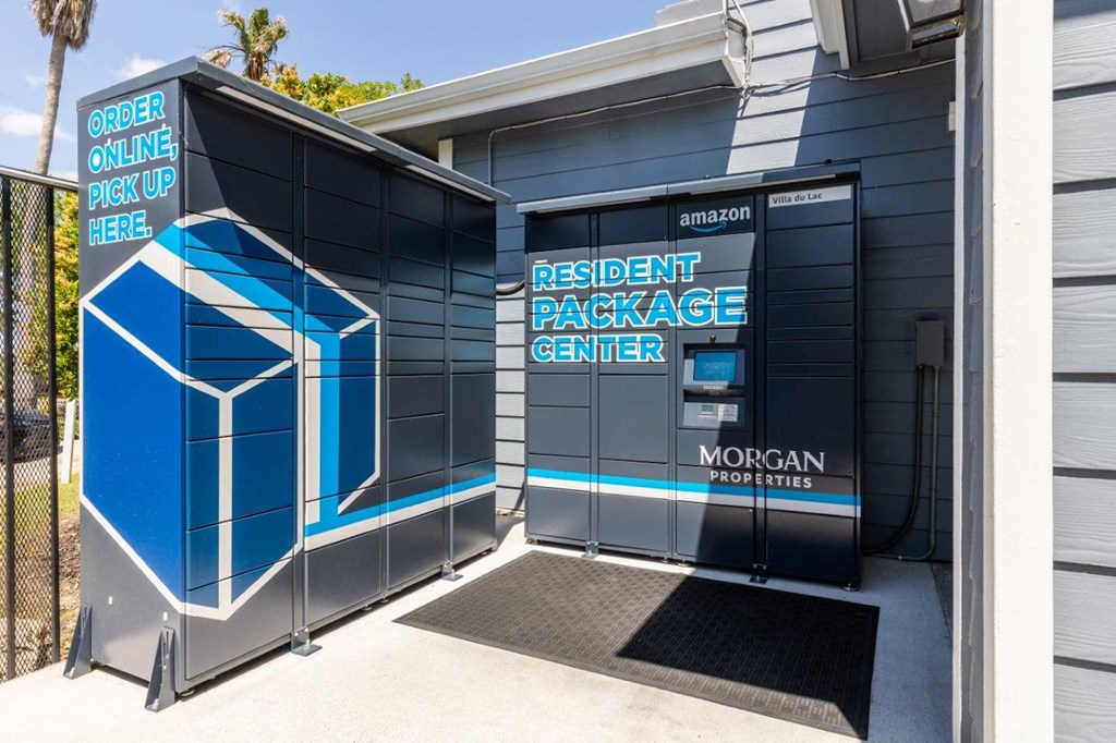 the exterior of a parking garage with a wheelchair ramp and a door to a building
