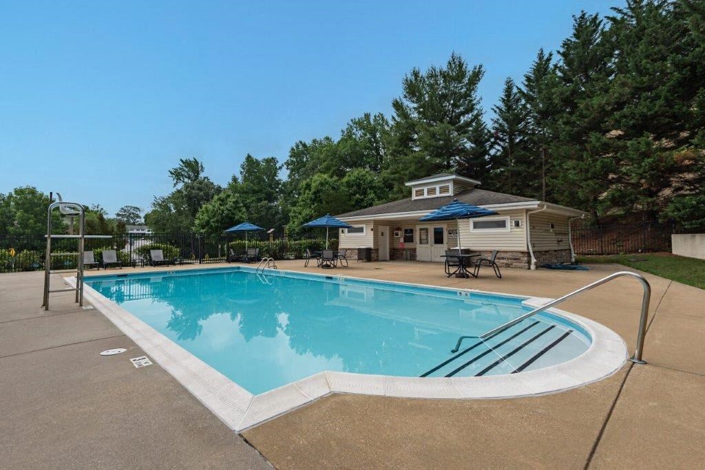 a swimming pool with a fence around it