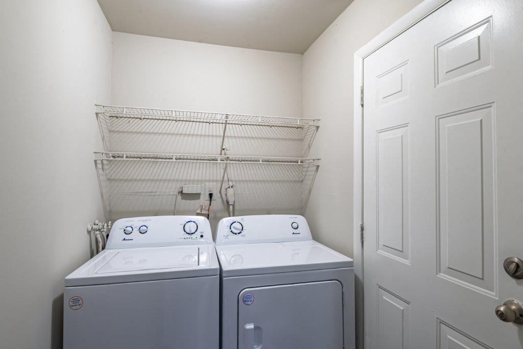 a laundry room with two washes and a dryer in it