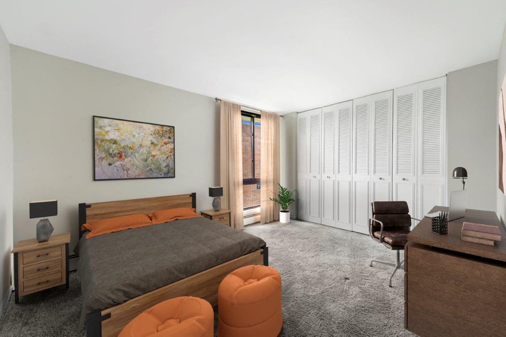 a bedroom with a bed and a desk with a chair