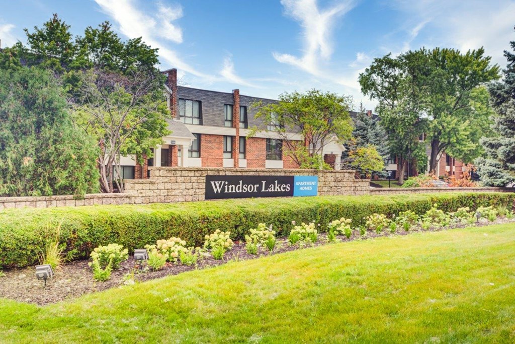 a view of the winchester lakes campus with a sign in front of a building