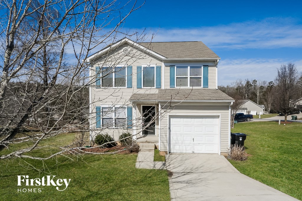 A house with a garage is for sale by FirstKey Homes.