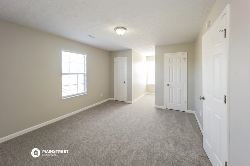 the spacious living room and dining room of this manufactured home