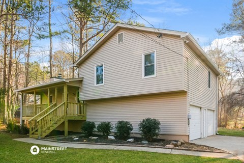 a yellow and with a deck on the side