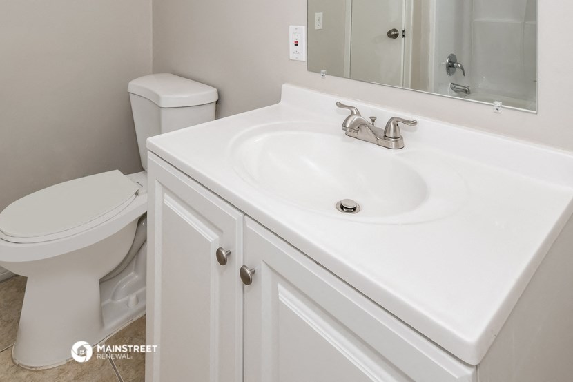 a bathroom with a sink and a toilet