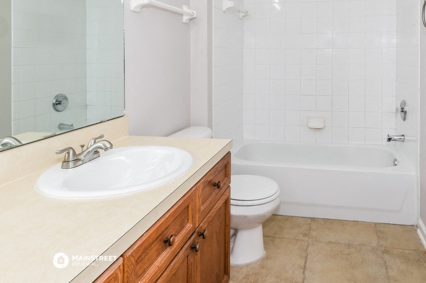 a bathroom with a sink and a toilet and a tub