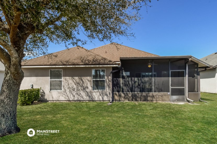 a house with a tree in the front yard